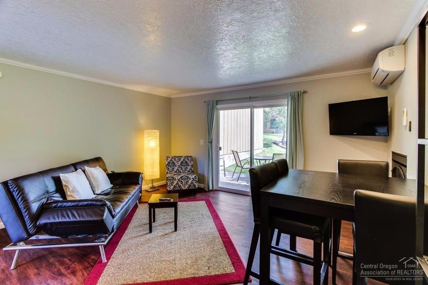 This beautiful condo next to Pioneer Park is just steps from the river and downtown Bend. Comes fully furnished with an active vacation rental license. Unit is on lower floor and back door opens into a park like setting.This unit is great as a primary residence, second home or investment. This unit won't last!