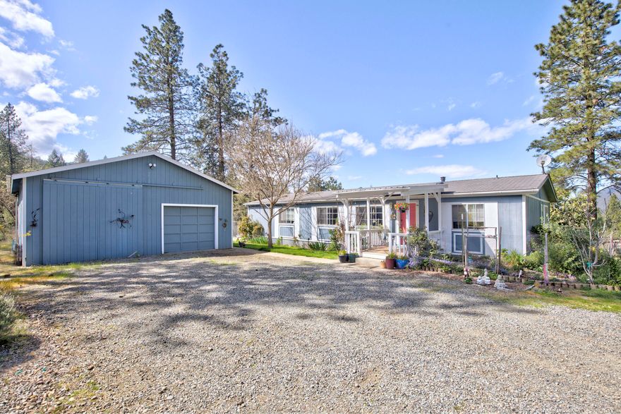 Beautiful hard to find horse property. Lots of level, fenced pasture for horses or any kind of animals or a huge garden area. Really nice mfg home with vaulted ceilings, wood stove, nice sized bedrooms, laminate floors, tile kitchen counters, inside laundry room. Big deck to enjoy the gorgeous mountain views. 30x30 shop/garage with cement floors. Has a hay barn, grain storage, greenhouse, chicken coop, fenced/raised garden bed area. Fenced pasture areas with animal shelters. Has a dry lot area for horses. Lots of trailer/extra parking. So many amenities!