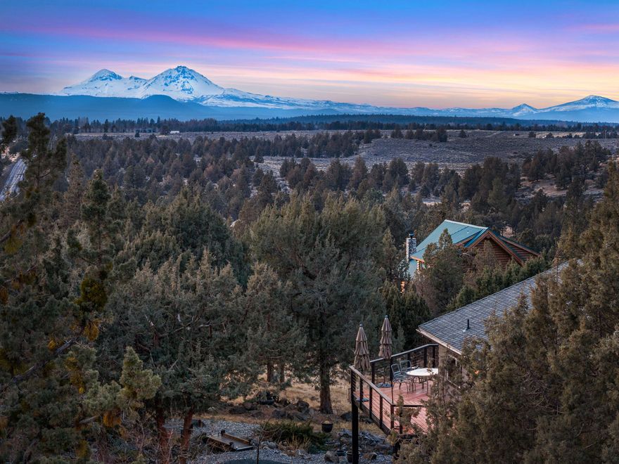 Coveted Tumalo location and breathtaking, unparalleled mountain views — now offered $100,000 below appraised value!

This 2,238-square-foot, 3-bedroom, 2-bath retreat captures sweeping vistas from Mt. Bachelor to Mt. Hood from nearly every room. Thoughtfully designed to showcase the awe-inspiring scenery, the home offers a serene, light-filled atmosphere that blends privacy with natural beauty.

Situated on 2.28 acres, the property is a true oasis with mature trees, beautiful landscaping, and a tranquil, meandering creek-style water feature that gracefully encircles the home. A paved driveway leads to a massive three-car garage and a generous paved parking area.

Don't miss this rare opportunity to experience the best of Tumalo living — stunning views, a peaceful setting, and an unbeatable value.