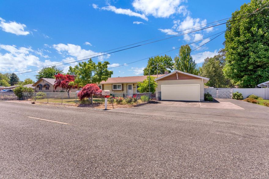 Tended to by an avid gardener for several decades, you will see the care and kindness carried through to the home as well. This 3 bedroom, 1.5 bath rancher features 1666 square feet including a large sun room and sewing center. Recent kitchen updates brought new cabinets, appliances, and granite counters. Other upgrades include refinished wood floors, newly rebuilt deck, insulated windows, and heat pump. 
Now the fun stuff... besides an attached two car garage, there is an additional 2-car-sized shop with 3 attached dry rooms for additional uses. Large RV barn also offers a bevy of options for dry storage for equipment, toys, etc. Located in the heart of the Redwood area, enjoy the scenic views of the mountains around the valley. There is more to this property so don't miss your chance to tour the property to take it all in yourself!