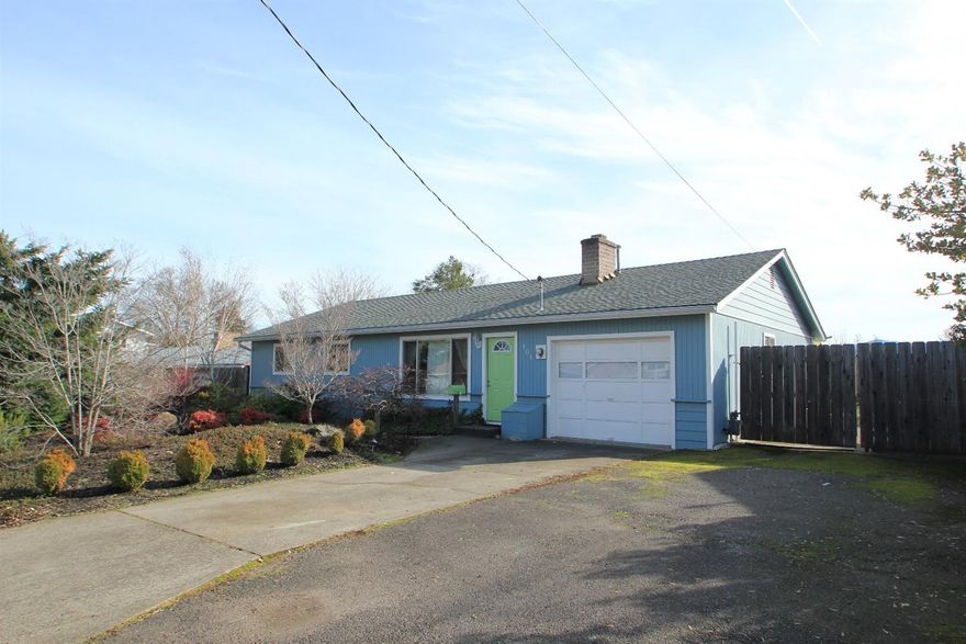 This nicely updated central point home is located right between crater high school and scenic middle school for easy convenience. Beautiful hardwood runs through the entire home. The kitchen is wonderfully updated with natural colors. The living area is highlighted by the cozy fireplace. The laundry room is spacious and well lit. The huge lot offers a nice open fully fenced backyard with access from both the dining area and the master bedroom. There is a Nice deck off the master bedroom for relaxing as well as a great shaded patio for entertaining. The fenced in dog run is a great bonus. RV parking is wide enough for all of your toys and runs from the front of the lot all the way to the back. Just moments to the local market and easy access to downtown as well as I-5.