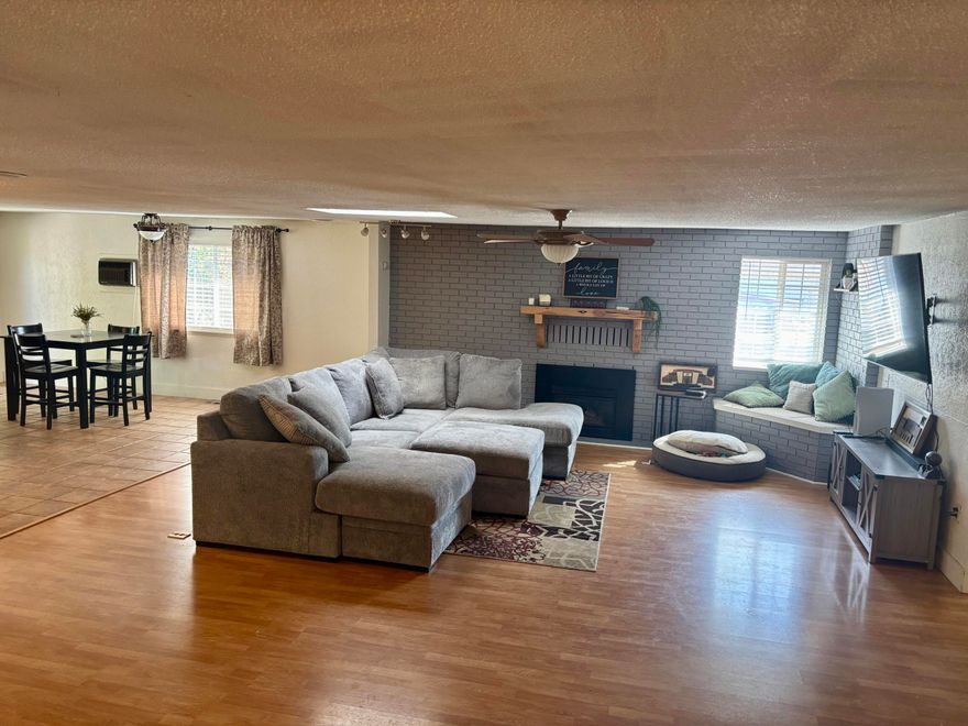 This home is over 1900 sq. ft. located in Sunset Village, with three bedrooms 2 baths, split floorplan all on one level. Beautiful kitchen has stainless steel appliances and solid surface countertops. Large open floor plan with the living, dining and kitchen area is open so guest and family can all be within one big area. The primary bedroom is on one side of the home with an additional bedroom and the third bedroom is on the other side of the home. The backyard has a circular fire pit and on each side of the home there is a possibility for RV parking.