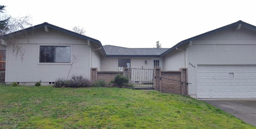 Doesn't get much better than this! Home has nearly 2000 square feet of living space! Four bedrooms, 3 1/2 bathrooms, open floorplan, wood and tile floors, nice bright kitchen with LOTS of storage space, and a HUGE attached garage -- all on almost a quarter of an acre in desirable East Medford!!! This one won't last long for sure! Bring this home back to life with your repair work.