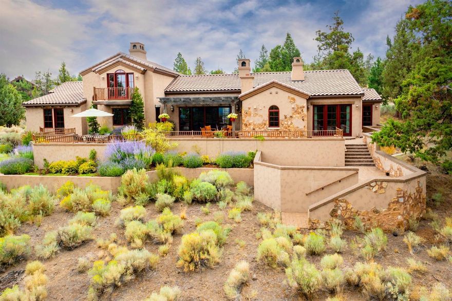 In North Rim's gated community on Bend's westside, this perfect blend of Tuscan & NW architecture offers the very best in luxury living. The home is positioned to capture Cascade views plus sun year round. At the heart of the floorplan is a grand great room w/ vaults & wood beamed ceiling, towering stone fireplace,lg open kitchen(updated w/Gaggenau & Sub Zero appliances, quartz countertops, new cabinets) dining rm w/morning courtyard, hickory flrs, Wine cellar,media rm,3 other fireplaces, terraced pvr decks