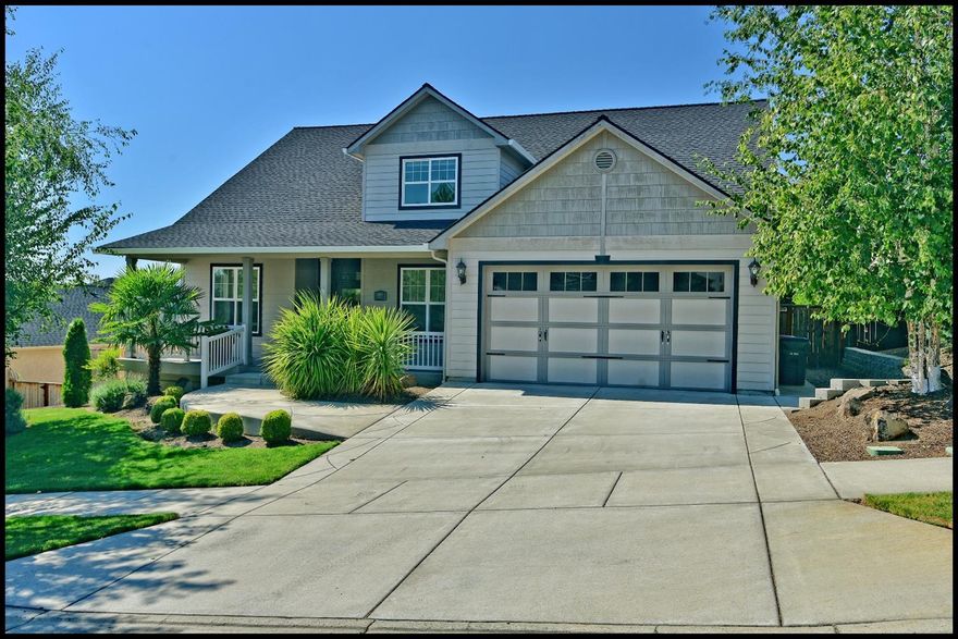 Beautiful East Medford craftsman style home! Wonderful open floor plan. Luxurious kitchen w/custom cabinets, dual ovens, stainless appliances, granite counter-tops & walk-in pantry. 1st floor master suite with tub, separate shower & dual vanities. Executive office with french doors & large great room with fireplace. Upstairs has 2 large bedrooms, large media/hobby room (or 4th bedroom) & separate storage. This home has many upgraded features including plumbed for central vacuum, upstairs is wired for surround sound, home is wired for alarm system and has dual climate zone plus stub out for gas bbq on back deck. Beautifully landscaped with front and rear covered decks. Great location and 3 car garage!