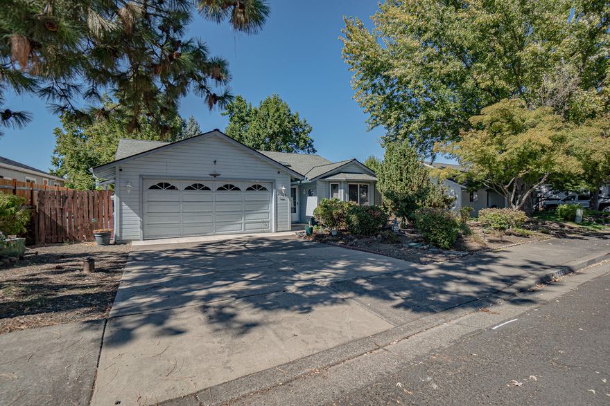 Welcome to this beautifully maintained, single-level home in on East Medford's most desirable neighborhoods. Original owner, first time on the market. Built in 1995 and offering 1547 sq.ft., this residence combines comfort, convenience, and timeless style. Inside you will find a bright and open floor plan, designed for easy living. New flooring throughout, the house includes vinyl in the kitchen & eating area and new carpet elsewhere. The spacious living room centers around a cozy fireplace, creating a warm gathering place for family & friends. The kitchen offers plenty of counter space and storage with an easy flow into the dining area. With three bedrooms and two full bathrooms, including a primary suite with walk in closet, this home provides both flexibility and privacy. Sitting on nearly a quarter of an acre lot, the backyard is ready for entertaining. Mature landscaping in the front and back. Two car garage. Move in ready and waiting for new owners.