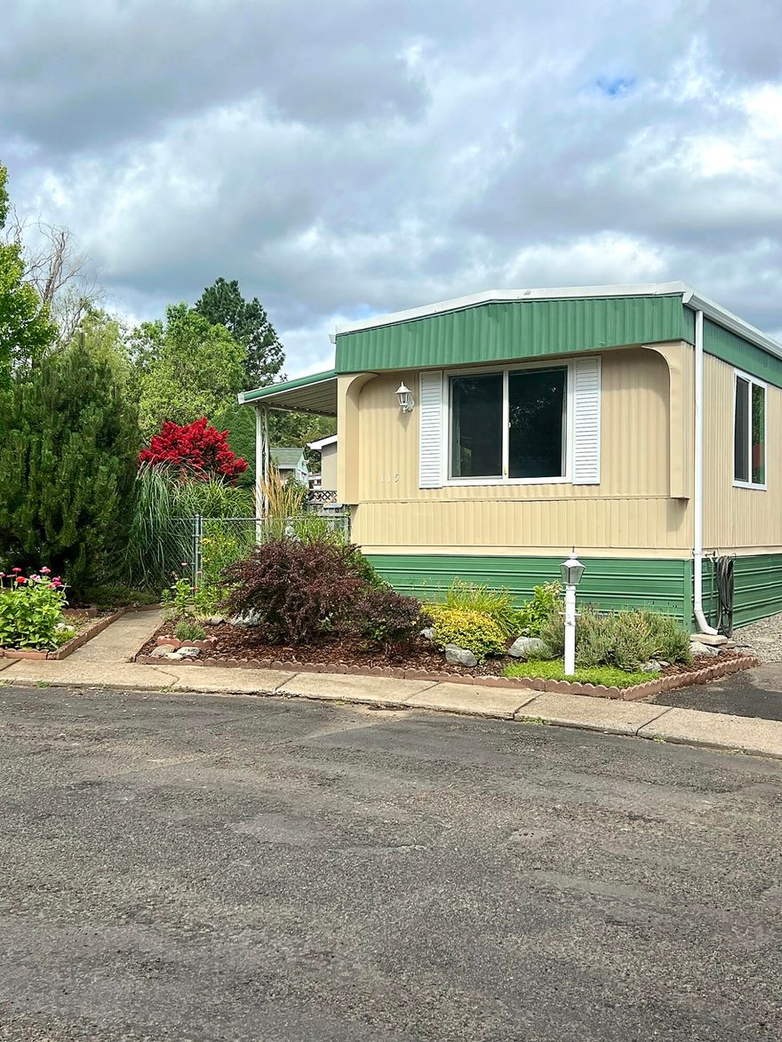 Motivated Seller! Enjoy $21,000 in recent price improvements on this beautifully updated home in the highly desirable 55+ Royal Mobile Estates, nestled in the charming and historic town of Jacksonville. Situated on a quiet cul-de-sac, this home offers comfort and style inside and out. The spacious, landscaped yard features a large covered patio—perfect for outdoor living—and a carpeted bonus shed ideal for hobbies, art, or storage. Inside, the open floor plan shines with tasteful upgrades: fresh interior/exterior paint, updated kitchen backsplash, new faucets, modern lighting, new carpet in the living and guest rooms, and rich laminate plank flooring. Community amenities include a clubhouse with patio, covered mail station, open green spaces with walking paths, pond and benches, utility building with laundry, and optional RV storage. Don't miss the opportunity to own this charming home in a truly beautiful and well maintained park. Schedule your showing today!