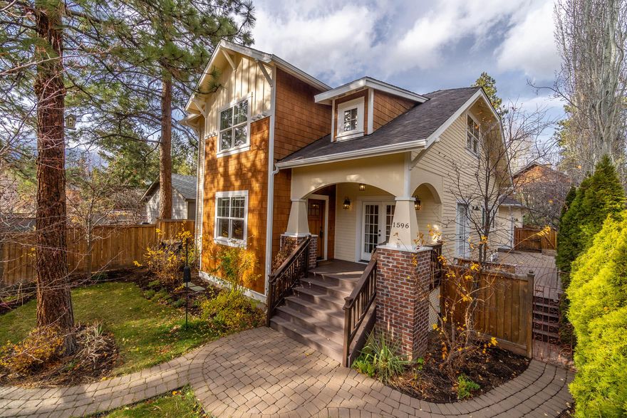 Custom built craftsman style timeless beauty located on The Westside one block to Overturf Park/Off Leash Dog area, 3 blocks to The Galveston Corridor and 1 mile to the heart of downtown. This 2,340 sf well maintained home has 4 bedrooms with a master on the main, 2 1/2 bathrooms including a Jack and Jill on the second level, a living room with gas fireplace, dining room with 2 sets of French Doors, a Chef's Kitchen with Silestone Quartz center island and a spacious pantry. Solid surface flooring throughout including hardwood floors on main level. Solid wood doors, wainscoting, newer light fixtures. Mudroom/laundry room with utility sink leads to the 2 car garage. Mature landscaping with native plants, a designated garden area, 4 zone irrigation and drip system on timers. Paver patio and Trex decking complete a private outdoor area along with a fully fenced lot.  NEW EXTERIOR PAINT June 2021.