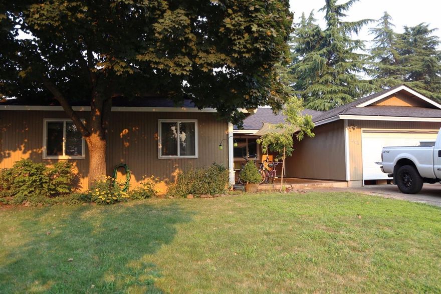Open house Saturday 9/9/17 1-3 and Sunday 9/10/17 11-1. Welcome home to your beautifully remodeled 4 bed, 2 bath home in a desirable Central Point neighborhood. This approx. 2,058 sqft home boasts an open floor plan which includes a 2 sided gas fireplace, wrap around windows, formal dining room, large living room & additional nook off dining room for extra living space. Glass doors lead off to your private backyard paradise to enjoy the grape arbor, covered deck, or the approx. 14x10 ft fully finished outbuilding. Back inside enjoy your custom kitchen, complete w/ gas range/convection oven, 2 pantries, granite countertops, laminate floors, & a large island. Relax in your master suite w/ remodeled en suite bath, big closets, & slider leading to the backyard. You will also benefit from the 3 large bedrooms & large bath. This well cared for home has new carpet, windows, heating & cooling systems w/in the last year, per seller. Don't forget the RV parking.