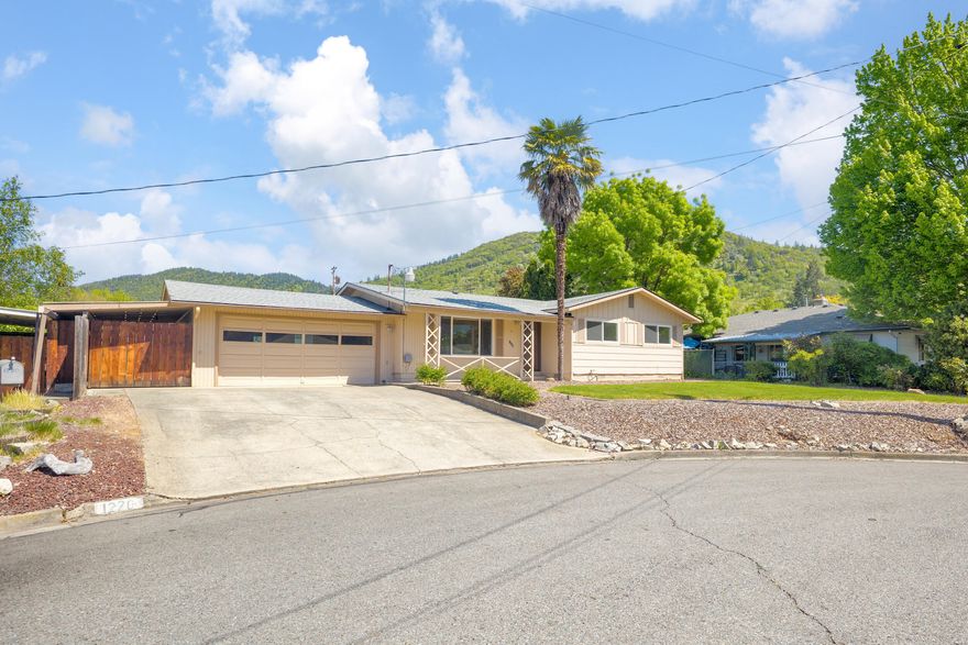 Tucked away at the end of a quiet cul-de-sac, this charming 3 bedroom, 2 bath home offers comfort, privacy, and beautiful mountain views right from your backyard. Built in 1965 and thoughtfully updated with brand new carpet and fresh interior paint, this 1,224 square foot home is move-in ready. Enjoy the outdoors year-round under the covered back patio, or let kids and pets roam freely in the fully fenced backyard and spacious front yard. The attached garage adds convenience, and the peaceful setting makes it a perfect place to unwind. Whether you are looking to settle into your first home or downsize without compromise, 1220 NE Duane delivers value, views, and a welcoming neighborhood feel.