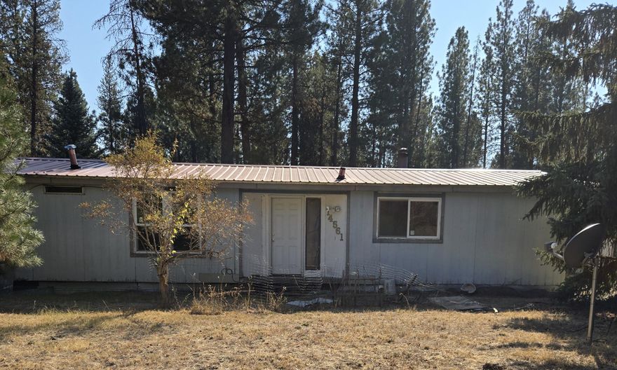 NEEDS NEW WELL AND SEPTIC. This level .80 acre lot features a 1979, 2 bed, 2 bath double -wide manufactured home. 573 sq ft outbuilding has potential for a great project space.
Fixer or an opportunity to build something new.
Serene setting with standard septic and private well.
CASH ONLY