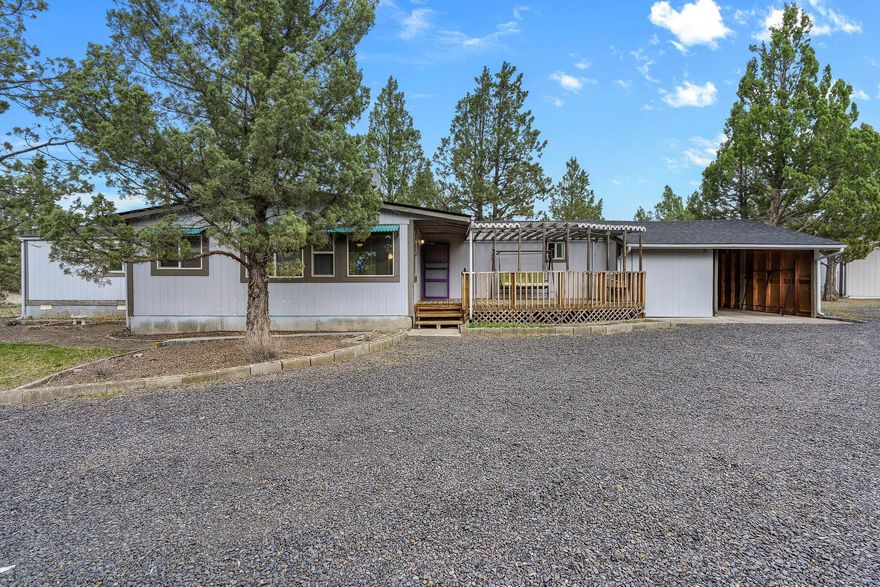 Don't miss this serene property situated on 2 private acres of the arid High Desert. Home ftrs 3 bedrooms & 2 full baths. An abundance of windows in the main living area allow for plenty of natural lighting. Kitchen ftrs breakfast bar seating, bright white cabinetry & plenty of counter space. Large eating area & addtnl living space w/sliding glass doors to the expansive back porch. Laundry room w/built-in shelving & cabinetry plus a mud room w/fridge & freezer. Two window AC units for summer cooling + electric forced heat w/smart thermostat. Beautiful Cedar front deck w/pergola & space for firepit or BBQ area. Attached carport plus addtnl covered parking in the shop & carport w/additional storage sheds. Plenty of space for all your critters & toys. Pre-inspection completed, 30x30 propane heated shop w/slab, wired for 220V & partially insulated + 10x20 storage. Private well w/backup cistern. Upgraded electrical panels in 2024, New roof in 2025 on house & shop. Don't miss this one!