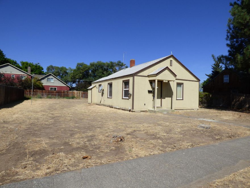 Fixer upper being sold in as-is condition. Cash only. Own a piece of old town Redmond. Established neighborhood and quite possibly the last home on the block that needs to be renovated. Close to all that downtown Redmond has to offer and easy access to Hwy 97. Single level, hardwood floors appear to be throughout & arched doorways. Kitchen has pantry, built in spice rack, wood cabinets, double sink and stove, fridge. Mostly double pane vinyl windows, newer double door fiberglass shower in the bathroom. Plenty of room for an RV or other outdoor toys. 12' x 18' shed w/6'' x 9' lean-to. Larger and level lot may accommodate an ADU and/or addition to the home. Buyers to be responsible for their own due diligence.