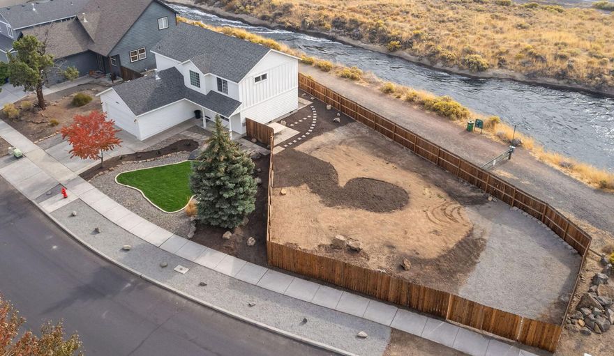 Thoughtfully updated home on a spacious corner lot with RV parking, located in the desirable Canal Row neighborhood and backing to the canal. Investment opportunity - possibility to subdivide and/or build an ADU/shop. Just steps away from Canal Row Park, & within close proximity to Pine Nursery Park, local restaurants, trampoline zone, schools, & more. This 3-bed, 2.5-bath home offers a comfortable, functional layout. The cozy living room with a gas fireplace flows into the dining area, which opens to a kitchen and family room, creating an ideal space for gathering. A convenient laundry room with a sink & cabinet storage, along with a half bath, are located on the main floor. Upstairs, the spacious primary suite features vaulted ceilings, a walk-in closet, dual vanities, and a walk-in shower. The two additional bedrooms share a Jack-and-Jill bathroom. Outside, enjoy a new back deck with ample space to design your dream entertaining area. This home is ready to welcome its new family.