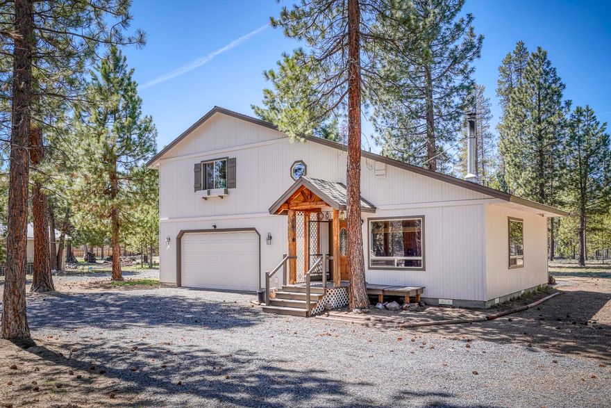 Bring all offers! Seller is ready to move. Lodge style, 2 bedrooms, 1.5 bath, 1,344 square foot stick-built home on .99 acres completely fenced and gated.  The home has been newly painted, and decks stained. Turn key! Rural zoning allows for horses. Both bedrooms are large enough to fit king size beds.  Kitchen has granite countertops and alder wood cabinets. Great room design with an elevated wood stove. The garage is 24 x 28 heated and insulated. Circular driveway in front and located on a cull de sac. The way the home is positioned allows for entrance to the back from either side of the home. Perfect home for a contractor who needs room for equipment.  RV Hookup, Small Shop and Storage Unit.  Washer, Dryer, Refrigerators in Garage, and home included plus the snow blower.  Hot water heater is Light duty Commercial 80 gallon.