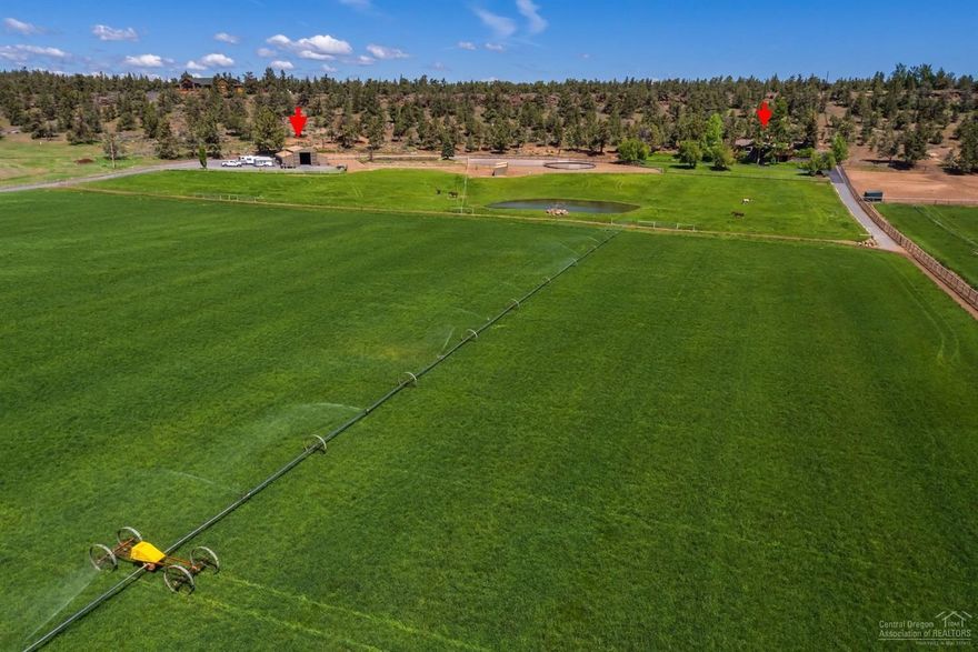 Tumalo home on 20 acres with 14 acres of TID water rights for green pastures creating a beautiful, private setting close to Bend. Custom home updated in 2008 is 3170 sq ft, 3 bedrooms, 3 bathrooms, main floor living with master suite, office, living room, dining area, chef's kitchen with granite countertops on main level. Daylight Basement includes: guest bedroom, family room, sun room, kitchenette and bathroom. Wonderful outdoor living spaces on the decks and covered porch surrounded by a landscaped yard overlooking the green pastures and field. The property features: 5 stall barn with tack room, wash rack, shop area, livestock turnout with shelters, 2 ponds, fenced, well maintained inside and outside. Property is close to Bend, Sisters and Redmond airport with Cascade Mountain Views.