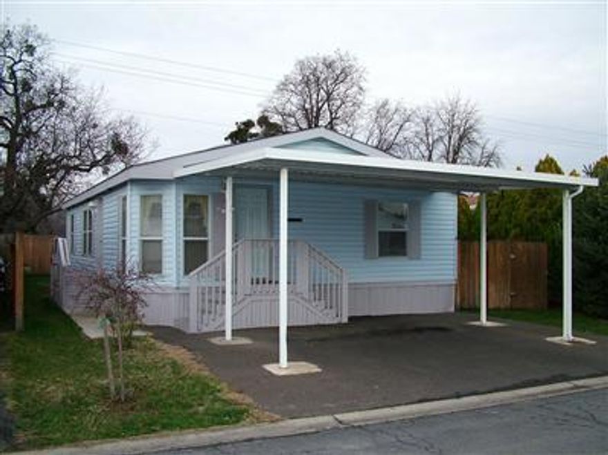 This Light and Bright home in Medford Estates is beautifully maintained and meticulously clean. It offers 3 bedrooms, 2 baths, utility room, three walk-in closets, a large living room, and an open kitchen with space for a table and chairs. It has an oversized shed and fenced side and back yards for privacy. Great location on a cul-de-sac. NEW KITCHEN FLOOR! Now includes washer & dryer, too! Space rent is $468/month.