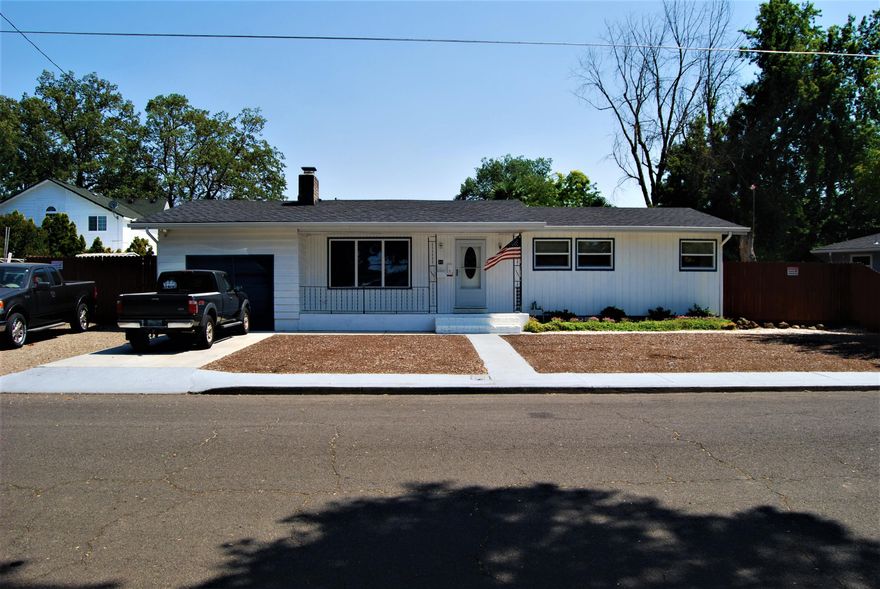 Beautiful rare 4 bedroom home in desirable Central Point Neighborhood.  Centrally located to Crater High and downtown.   This cozy home has had many improvements in the last few years.  Newer carpet, vinyl windows, kitchen counters and so much more. Freshly painted inside and out.  Living room offers a beautiful wood burning fireplace to keep you warm on those chilly nights.  Kitchen overlooks the large backyard and offers the perfect ambiance for entertaining as it also overlooks the living room.   Home sits on a large .20 acre lot.  Front and back yard are ready for you to create your own paradise. Plenty of space for RV parking as well. Don't miss your opportunity to call this home, this won't last long!