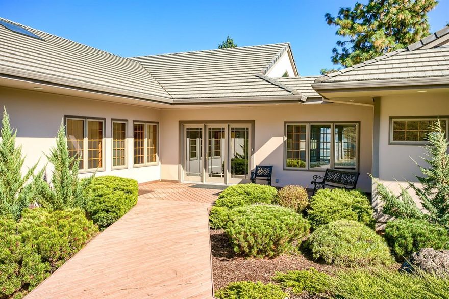 Incredible views of the valley & Mt. McLoughlin from this single story home. Perched on a 20-acre knoll this custom built home has 3595 sqft, 3 bed/ 2 baths with tons of open space, vaulted ceilings and lots of natural light from the many Pozzi windows throughout. Spacious kitchen features granite counters, large dining area and lots of custom cabinet space. Huge open living area as well as bonus room with walls of windows providing great views. Spacious master suite has vaulted ceilings with French doors to the deck, large master bath with walk in closet, custom shower, and cabinets. Built in hot tub & extensive wrap around Timber Tech decks to enjoy those miles of views. Owners have taken great care of this home with only the best materials used and regular maintenance. Large oversized 2 car garage with cabinets for storage, private gated entry as well as a fenced in area to garden or have pets. Only a few miles from town but lots of privacy!