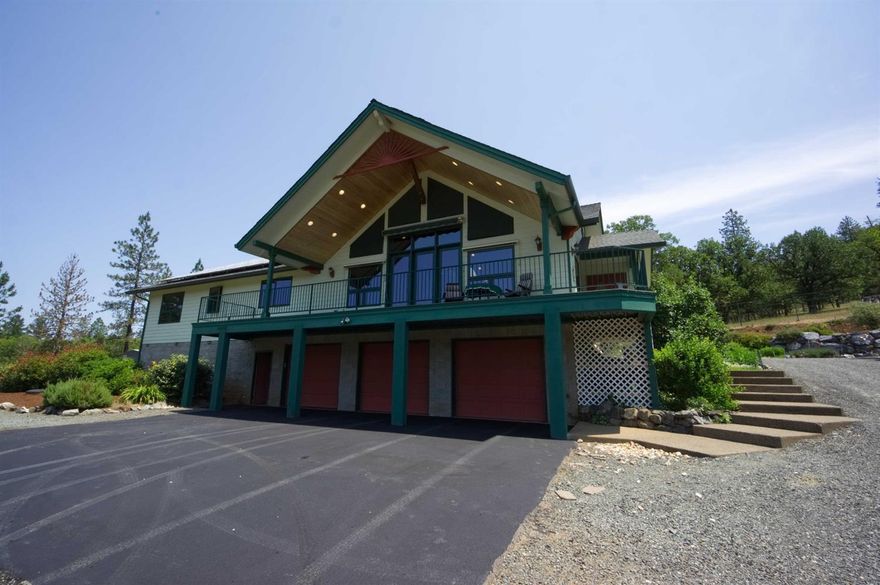 Live a Fairy Tale Life in this unique One-of-A-Kind classic, country style home just minutes away from the world famous Rogue River. Beyond wrought iron gates you'll explore a world of you own - your own private retreat bordered by over 2000 acres of land no one will ever build on. Take in the views from your deck looking out over the forest. Enjoy a huge 5+ car garage w/ample room for a shop, or a place to store those classic, vintage automobiles you treasure. Inside you'll feel the wide open expanses, soaring cathedral ceilings w/custom windows bringing light & the outdoor paradise that surrounds you into all the interior spaces you'll enjoy from the moment you wake up until you lay your head to rest at night. Other amenities you're sure to notice are the gourmet kitchen, slate flooring throughout, custom fireplace w/hand-hewn copper mantle, walk-in tiled showers, central vac, on demand hot water... and so much more. Your personal Shangri-la awaits YOU! Call to tour this home today