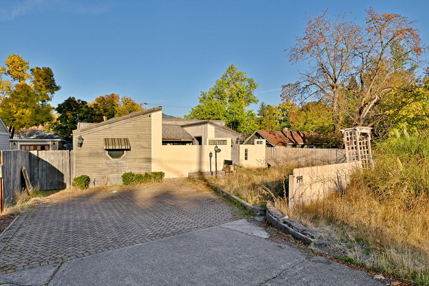 Amazing location in East Medford with so much potential! over 1500 sq dt with a split floor plan. Home offers a Unique courtyard entrance. Sliding doors to most every room in the house. There is some deferred maintenance needed, but with location, size and unique architecture, this home is perfect for someone with a vision to bring it up to it's full potential. Seller is motivated.