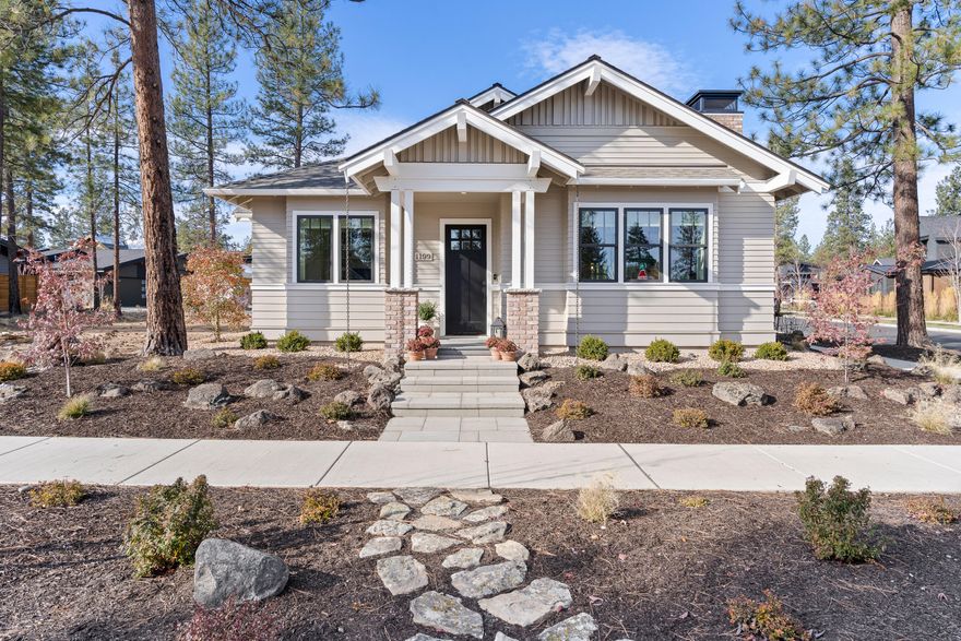 Welcome to the perfect blend of modern convenience and respite from the hustle and bustle of city living. Situated in the Discovery West community, this beautifully crafted home by Salvesen Homes, offers just the right amount of understated elegance. Positioned on a corner lot with views of the tranquil greenbelt, it is sure to captivate with its style and charm.  This single-level home offers designer extra wide plank flooring, shiplap, and special touches like Hammerton Lighting and Ann Sacks Tile. With its open kitchen, Wolf range and plentiful storage, this home is a Cook's delight. Whether entertaining friends and family, or snuggling up in front of the cozy fireplace, this home checks all of the boxes.   With two good sized bedrooms, plus a den/office with custom built in cabinets, this plan offers great flexibility.  Enjoy the great outdoors on the paver patio surrounded by granite boulders and a low-maintenance garden. Downsize without giving up quality, this home has it all.