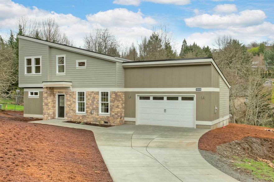 Beautiful contemporary home in the hills in East Medford just completed in 2016. This home features 2340 sq ft with 4 bedrooms, 2 1/2 baths plus bonus room. The kitchen with granite countertops, complete with double ovens & island cooktop, opens to the great room with gas fireplace and prefinished hand scraped hardwood flooring throughout. Master suite includes walk-in closet, tiled flooring, granite counters with double sinks and walk-in shower. The other 3 bedrooms, with large closets are upstairs along with bonus room and 2nd bath. LEED lighting and interior sprinkler system are a couple more of the added features in this beautiful home. There is an oversized finished 2 car garage and low maintenance landscaping. Beautiful home ready for it's new owner.