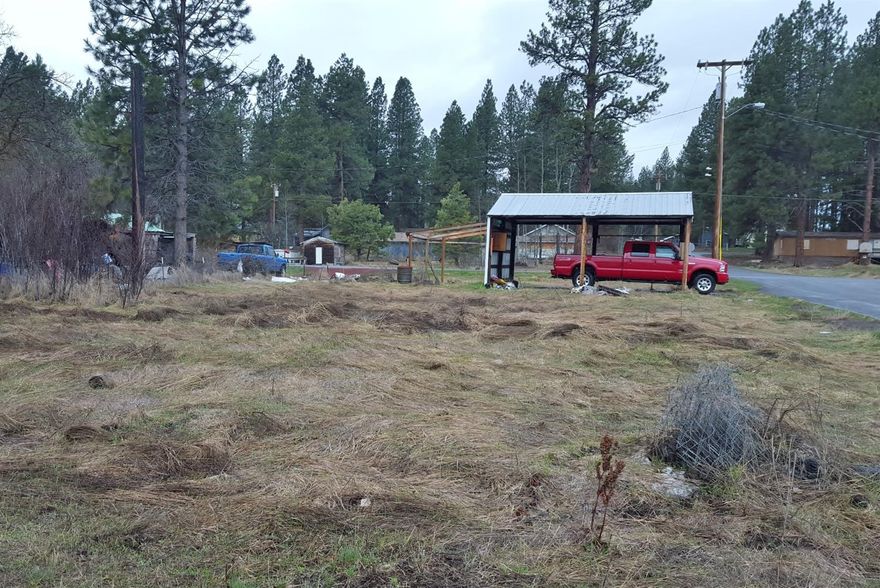 Level Lot - Ready to place a Manufactured Home or Build! City Water, Sewer, & Electricity are in. Other services available. All the hard work has been done, and there's a carport on the Lot as well. Drive by and check this one out!