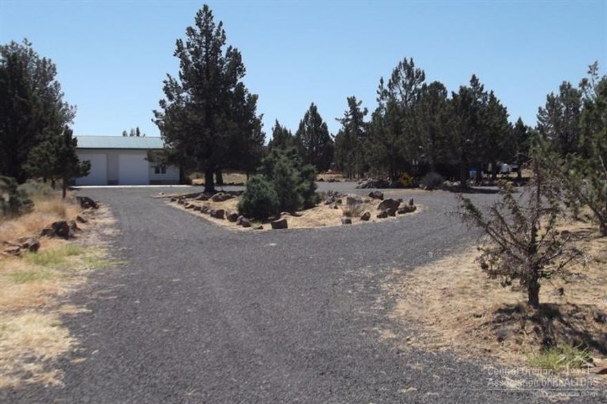 2 acres located on the desirable Upper Canyon Rim, graveled w/turn arounds and extensive parking, 24X36 pole barn w/concrete floor and 2-10' roll-up doors, septic installed, cistern, 39' PUMA trailer in excellent condition w/ wood deck and over-hang. Ready for camping AND storing all your toys. Come enjoy all that Three Rivers and Lake Billy Chinook has to offer. Move-in ready. Quick closing.