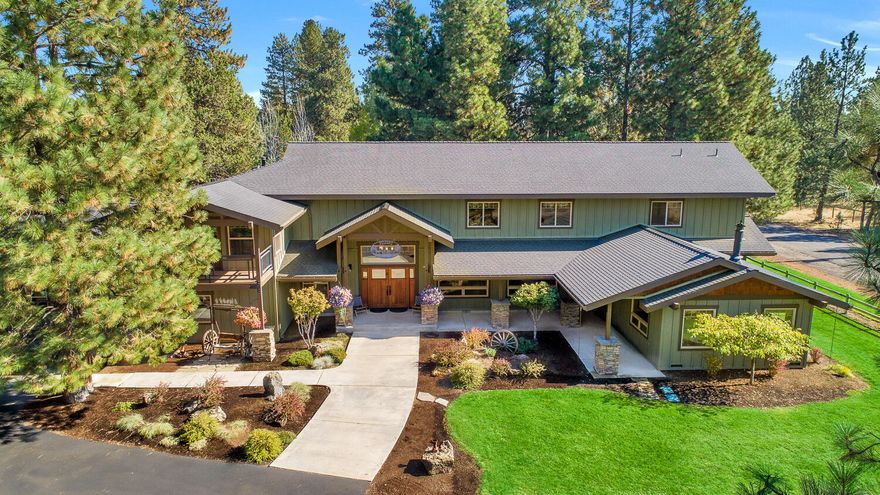 Western Chateau: 2 dwellings & potential for 4 separate living areas for extended family/rentals. Private lushly landscaped acreage with direct access to 1000's of miles of National Forest trails while being a short walk to the vibrant town of Sisters. 3887sf ''Lodge'' home features: Craftsman timber frame truss beams; suspended stairs; High vaulted ceilings; Wide plank hickory floors; Open floor plan; Large entertainers kitchen; High-end stainless appliances; Upper primary bedroom with balcony deck; 2 ensuite bedrooms with remodeled bathrooms, walk-in tile showers; Separate bed/bath downstairs with lock-off and private access; Giant mud/laundry with abundant storage; 3-car garage with oversized doors. Detached 1680sf ''Barndominium'' easily divides into 2 distinct living spaces. 2400sf shop with RV parking and hookups. Exterior features: Hay storage; Underground pasture irrigation; Enormous paved driveway; Numerous majestic ponderosas & aspens; Open pasture borders back of property