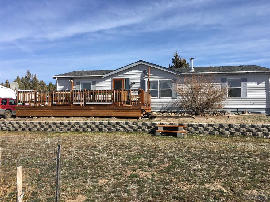 A beautiful 3 bedroom, 2 bath 1404sf home on 5 acres approximately 8 miles from Prineville. This house has almost 1000sf of decking with approximately 520sf covered! The property is fenced with a gate at the driveway and has a nice storage shed. It has a nice fire pit area, stunning views and the junipers have been trimmed up. Would make a great horse property, won't last long!