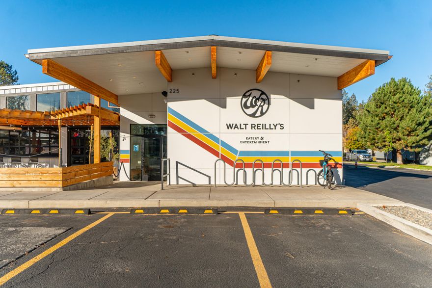 Walt Reilly's is a one-of-a-kind opportunity to own a restaurant/event space on Century Drive directly across from the new West Side Yard. The property went through an extensive multi-million dollar renovation in 2020 that took over 18 months. SDC fees were paid for the current use, an upgrade in excess of $225,000. The remodel featured a state-of-the-art kitchen with walk-in refrigeration, a high-end bar, new restaurant furniture and décor, performance stage and premium surround sound system, 3 golf simulators, 9 hole miniature golf, and a batting cage.
A buyer can purchase the building for their own use, or can build off of what the owners have started. Other approved uses for the building include retail sales, office and clinics, day care, conference center, and club. The land is zoned MU, which allows for a variety of commercial uses.