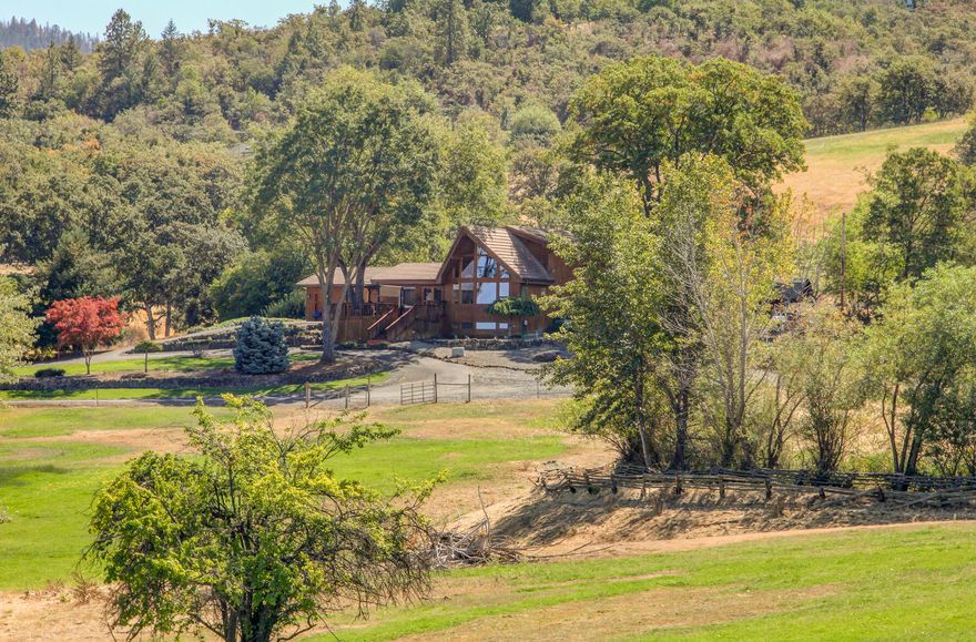 Quiet rural living on nearly 25 acres with panoramic views of the Rogue Valley and located within only minutes of town! This energy efficient, ''Good Cents'' home features 20' ceilings and plenty of tall windows to enjoy the incredible views. Granite slab counters, solid wood & natural stone flooring. Large deck area off the front and back of house are perfect for entertaining. In-ground swimming pool with heater and spa, solar heated outdoor shower and outdoor cooking kitchen. Wonderful set-up for crops, horses, cattle & other livestock. Irrigation rights, pond, large barn (roughly 40x60) w/hay storage & tack room. 3 car garage, 5 bay equipment shed w/shop, large 24x24 storage area with 12' slide door, 60x15 RV storage. Plenty of garden space and 2 large finished sheds! This farm use zoned property is versatile, located at the end of a paved and private drive and has so much to offer!