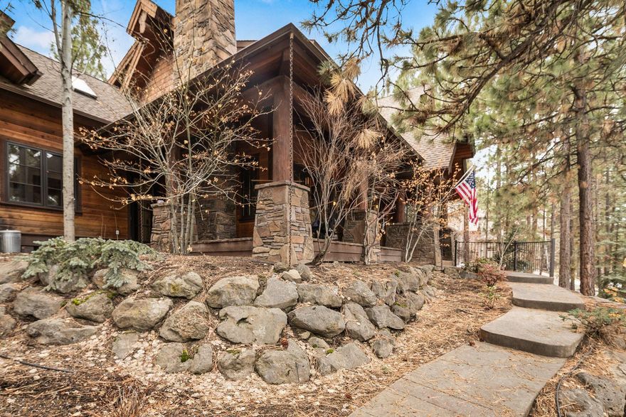 Unique NW lodge style home nestled on a .66 acre private wooded lot that feels like you are out in the Cascade Mountains. The view out just about every window is of the mature trees and landscaping that surrounds this home, creating your very own in town private oasis. This wonderful home has old growth ponderosa log beams throughout, with a magnificent floor to ceiling two story stone fireplace complete with a wood burning insert for those cold winter nights. The owner has carefully selected designer light fixtures, flooring and paint that adds to the ambiance of this unique loved home. Two of the four bathrooms have been completely remodeled this year with full tile showers, designer plumbing fixtures and glass doors. The South facing sunroom is a great place to have your morning coffee while taking in the view. Out the back door you'll find more private outdoor living complete with a covered porch w/hot tub and tiered paver patio and path leading to a Park w/pickleball courts.