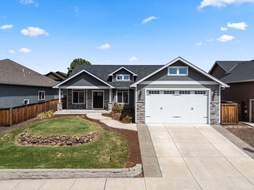 This like new home in the Blue Grass Downs neighborhood. This open-concept layout features vaulted ceilings and a chef's kitchen with island and breakfast bar—great for entertaining. This 4 bedroom 2 bath house has spacious bedrooms and the Master suite offers a walk-in closet, dual vanities, and tile shower with dual shower heads. The large backyard is flat, fully fenced with raised garden beds and a large patio.
The oversized 2 car garage has 11' ceilings, a 10' door for large vehicles and/or extra storage. This house is steps from the William Mott Memorial Park and playground. Schedule a tour today!