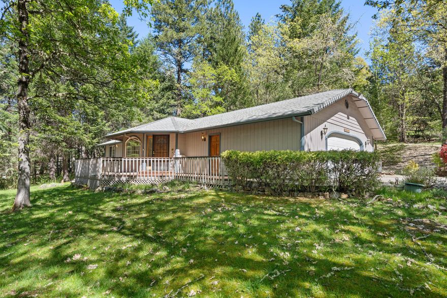 Really nice single-story Super Good Cents home featuring 3 bedrooms and 2 full baths in over 1,500 sq ft (per assessor) of living space, on a private treed 1-acre lot.  The attached oversize 2-car garage has an adjacent shop/hobby room, and the large concrete driveway pad can accommodate off-street parking for 4+ additional vehicles.  The living area features vaulted ceiling, a dining area, and a slider to the back patio with tranquil waterfall.  Privacy and quiet in a nice country setting, yet just minutes from shopping, restaurants, medical services, and schools.  Must see!