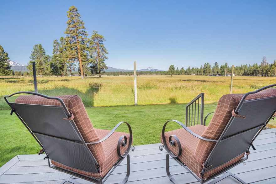 Stunning Cascade Mountain Range and Pole Creek Ranch pasture views from your living, dining, kitchen and back deck. Interior of condo features: first level unit; open floor plan; large wood frame windows; light & bright; propane fireplace; primary bedroom with walk-in tile shower and walk-in closet. Exterior condo features: covered front deck; open back deck with huge views; detached 1-car garage; all exterior maintenance of building and grounds covered by additional HOA fees. Pine Meadow Village features: swimming pool & jacuzzi, tennis courts; clubhouse; extensive waterway and water features; meandering walking path; open spaces. All within a short walking distance to downtown Sisters shops and restaurants as well as Peterson Ridge trails