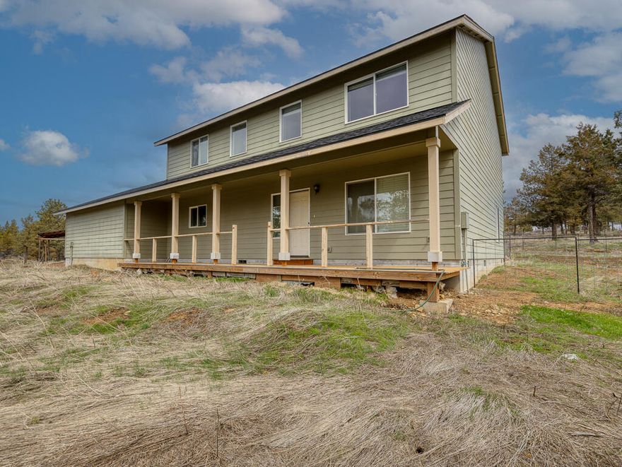 Hard to find acreage. This 4 bedroom 2.5 bath sits on 121.41 acre parcel just outside of Bonanza. The primary bedroom is on the main level. An upgraded new LVP flooring with 22 mil wear rating has been installed. It has a very open floor plan with a huge family room. All the bedrooms are good sized. There is some cross fencing for animals including horse shelters, pig tight pens, farrowing barn and. The property does have an adu hookup. There is a storage shed and covered RV carport. It would almost impossible to put this land, home package together from scratch if you had to buy the land, set up the septic, drill a well and built this house on it. There is area for dry land farming