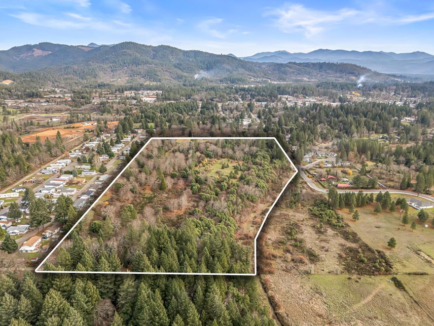Attention developers!! If you're looking for a high density (SR zoning) parcel mins away from Downtown Cave Junction, this is the one for you! This 24+ acre wooded property features easy access throughout the year with amazing views of the mountainside. Majority of the property is flat with a mild slope in certain areas. City water and city sewer are obtainable. Buyer to perform their own due diligence pertaining to the possibilities of building and permitted uses. Perfect opportunity for anyone looking to develop a subdivision and/or build their dream home in a private setting close to town, so contact your agent today for a personal tour, before it's too late!