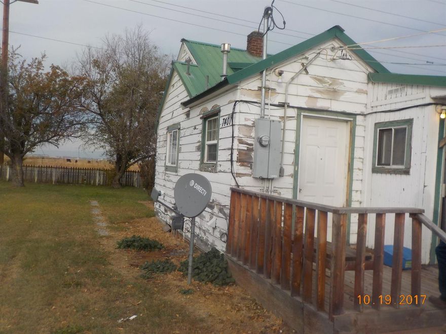 Two single family homes on one tax lot. Shared well and septic systems. Detached garages for both. Need a little TLC. Both rented.