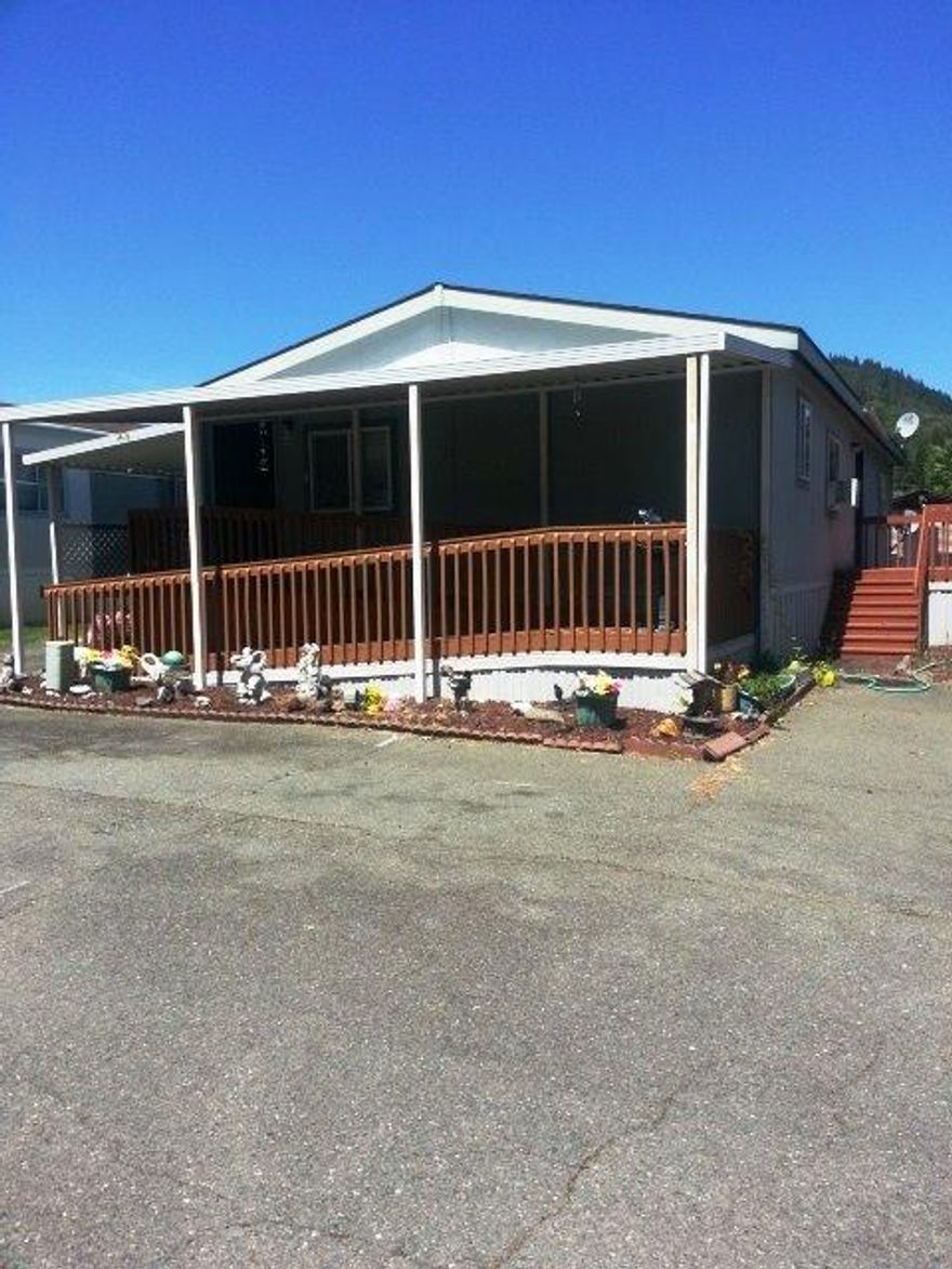 Come make this home your own.... This is 1998 1152 sq ft. 3 beds, 2 full bath, home has vaulted ceiling through out. A nice open kitchen make it easy to work in. French doors lead into a bedroom/office. It's location in the park makes for little traffic and peace and quiet. Two pets are allowed under 25# Park rent is $418.00 This friendly park is close to all Grants Pass to offer.