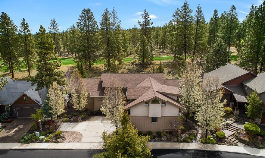 Backing to the 5th Fairway at Bend Golf & Country Club is this beautiful, light-filled entry and great room with soaring 2 story ceilings and open beams you have a clear sightline to the back deck. This architecturally designed home offers privacy galore with a large natural green space buffer to the course.   A perfect home for entertaining and relaxing with sliding doors off the great room, dining room & bedrooms. The back deck runs the length of the house for enjoying your early mornings with coffee and your beautiful Central Oregon evenings! Epoxy floors in the enormous 1,000 square feet heated garage with plenty of room for your golf cart. Primary suite on the main along with the separate office with built-in desk and a guest bed. Upstairs loft and huge bonus/bed and full bath with loads of storage! The finishing touches here are of the highest quality, from designer tiles, to hemlock doors, built-in buffet, cabinets, Jeld-Wen windows and Air conditioning.