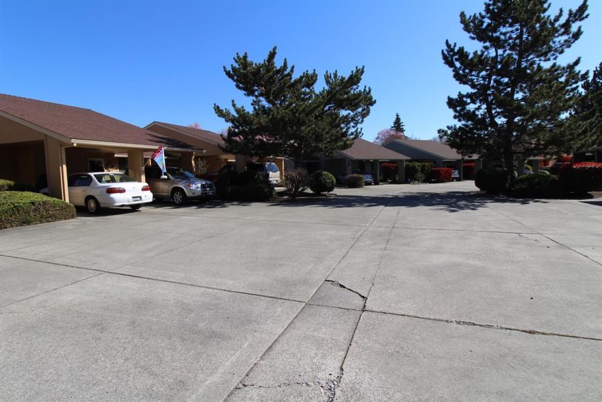 Comfortable single level Condo with an open floor-plan awaits new owners! This 964 Sqft home sits down a quiet drive and features 2 bedrooms and 2 full baths. It has been updated with new laminate wood flooring, granite counter tops in the kitchen, a new heat pump and features multiple sun tunnels that allow for an abundance of natural light throughout. It's also the only Condo on the block with a wood burning fireplace to keep you warm through the winter. It has a carport and a low maintenance private back patio along with two separate storage areas. The master suit is ADA compliant and offers higher counter tops, toilet and a larger walk in shower. Reasonable HOA allows for some peace of mind as it keeps up exterior maintenance and front yard landscaping. This is an excellent opportunity for first time home buyers or investors alike. Call today to come see it!