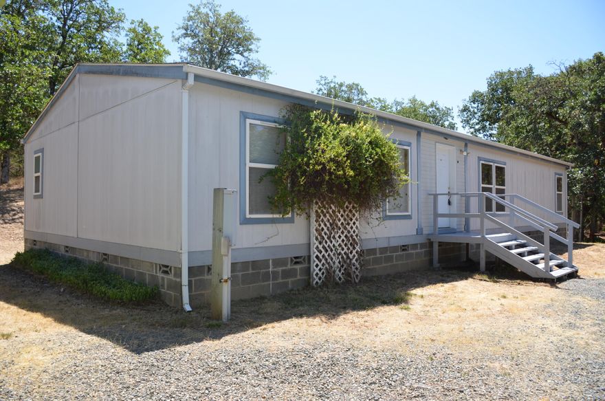 Perfect home with room to roam on 2.30 acres in the wooded country! Nice open floorplan with a living room and a family room. This Fleetwood manufactured home boasts 1620 square feet 3 bedroom 2 bath home with a circle drive. Fenced in garden area and dog run. Plenty of wildlife with deer and turkey around.  Detached carport, sheds, fenced side yard and low county taxes. Plenty of room to add a garage. This is not a drive by. All information deemed accurate but not verified, buyer to perform all their own due diligence.