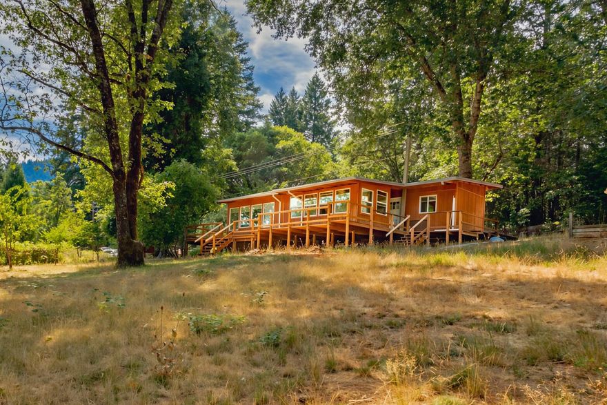 Enjoy a newly updated 2 bedroom 1 bathroom house that is nestled on 10 acres with a private forest, 2 acres completely fenced, fruit trees, large fenced garden, well and septic, barn, outbuildings,  and a whimsical Cob house that is a potential air bnb.
This property combines rustic charm with modern conveniences such as a ductless heating and cooling system, and updated appliances.
Conveniently located 20 minutes from Grants Pass and Roseburg is 45 minutes away. The historic Wolf Creek Inn is just a 10 minute walk . A local gas station and convenience store is right across from the Inn.
Come take a look at this country gem!