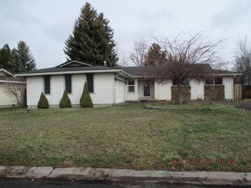 Located in an area of well-kept homes and tree-lined streets! The home needs paint, floor coverings and misc. repairs. The home has a very functional floor plan with dining area, family and living rooms.