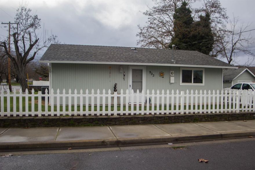 TURN-KEY home ready for your 1st time buyer or someone looking to downsize. Adorable home that has been completely re-done in 2016 inside and out. Brand new appliances, New flooring thru-out, new vinyl windows, new heating/air unit, paint inside and out new cabinets & countertops in kitchen and new toilet and large walk-in shower in bathroom. Open living, dining room and kitchen area. Corner lot that is nicely landscaped & completely fenced. Spacious driveway and storage shed. Within walking distance to elementary and Jr. High schools.