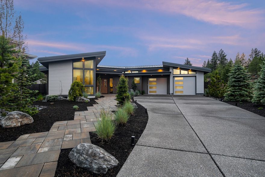 This stunning custom home has been built to perfection to capture the privacy and beauty of arguably the best lot in the award-winning Northwest Crossing community, overlooking permanent open space in Discovery Park. Floor to ceiling windows in the magazine-worthy vaulted great room bring the outside in, providing the feel of a private parcel in the woods, while only being steps from Discovery Park lake and the thriving commercial core of Northwest Crossing, featuring shops and restaurants. This single level home has been designed with the finest materials including walnut hardwood floors, cabinetry and built-ins, custom concrete countertops and a well appointed gourmet kitchen with ample workspace and high-end appliances. The spacious primary suite features a 2nd fireplace and spa-like bathroom with radiant floor heat and large soaking tub, while the 3-car tandem garage preserves the private setting and provides a workspace with a view. This home is truly an architectural masterpiece!