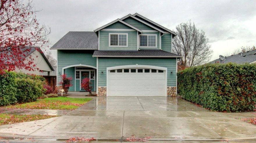 This one has the wow factor. Dramatic high vaulted ceiling with rock fireplace in the living room when you enter the home. Gorgeous hardwood floors throughout the downstairs. Look out the windows to your private and beautifully treed backyard. Large kitchen with island and eating/dining space with built-ins and house is all wired for broadband internet. Also has a large pantry and half bath off the kitchen. Laundry room is upstairs by the bedrooms. Upstairs is 3 bedrooms and 2 full baths with split floor plan. This is such a beautiful home... You will fall in love with this one.