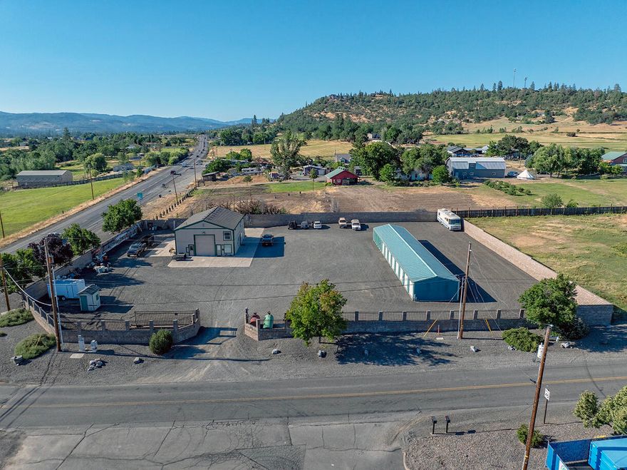 Owner Carry! Discover an exceptional investment opportunity with this 27-unit mini storage facility, comprising twelve 5'x10' units, fourteen 10'x10' units, and one 10'x20', totaling 2200 sqft. The 2,600 sqft metal building, includes a 1,440 sqft shop featuring 18' ceilings, two roll-up doors, and concrete flooring. The spacious office is equipped with AC, double-pane vinyl windows, and a break room with a sink and fridge. The upstairs loft, ideal for storage, includes a washer, dryer, shelving, and a sleeping area. Additionally, there's a downstairs bathroom with a toilet, sink, and shower. Situated on a level, graveled 1.16-acre lot, the property boasts a $100k cinder block wall surrounding the perimeter, and an electric sliding gate. With a well, water softener, pressure tank, two RV hookups, and a 2,000-gallon holding tank for sewer, this facility is fully equipped. Unapproved expansion drawings are available for further development. Pro forma calculated at a 4.5% cap rate!